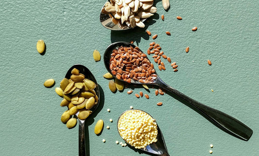 Spoons of assorted millets and whole grains